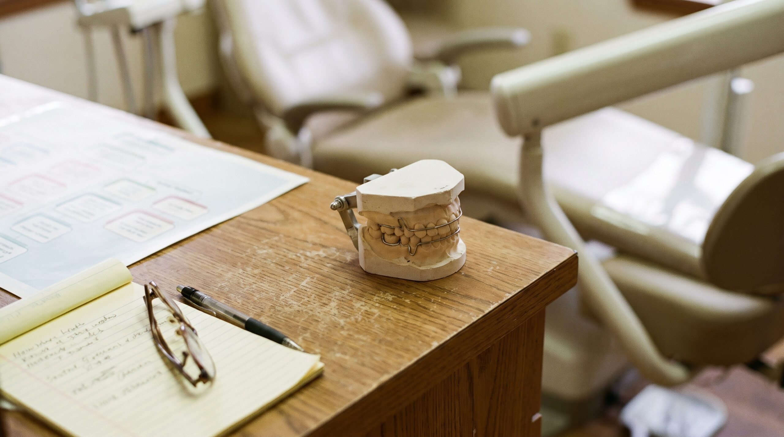 Dental practice financial records on a desk