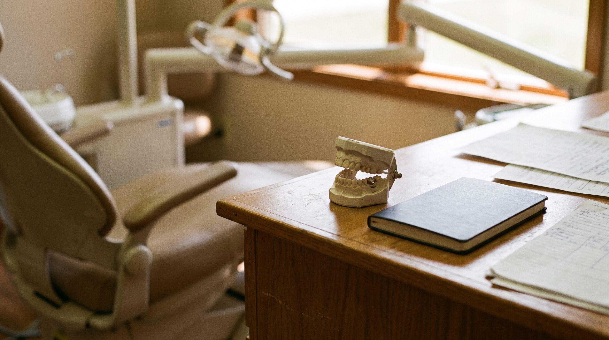 Dental practice financial records on a desk