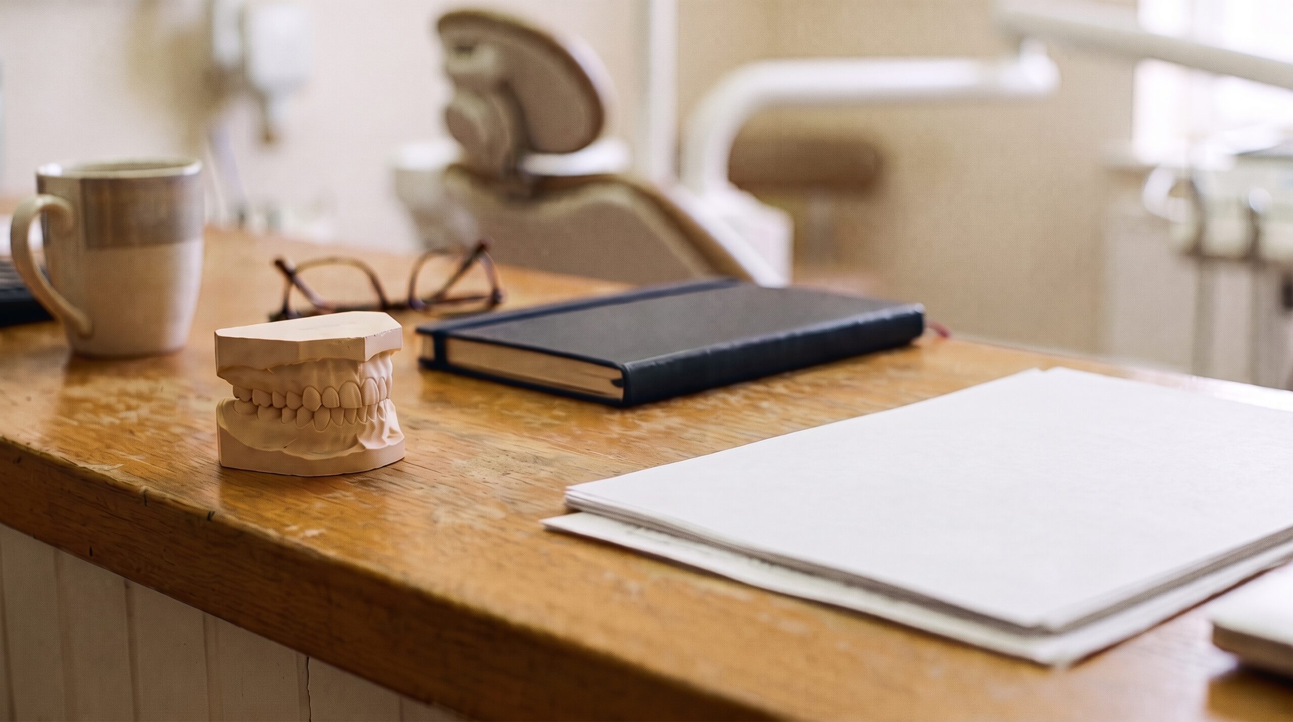 Dental practice financial records on a desk