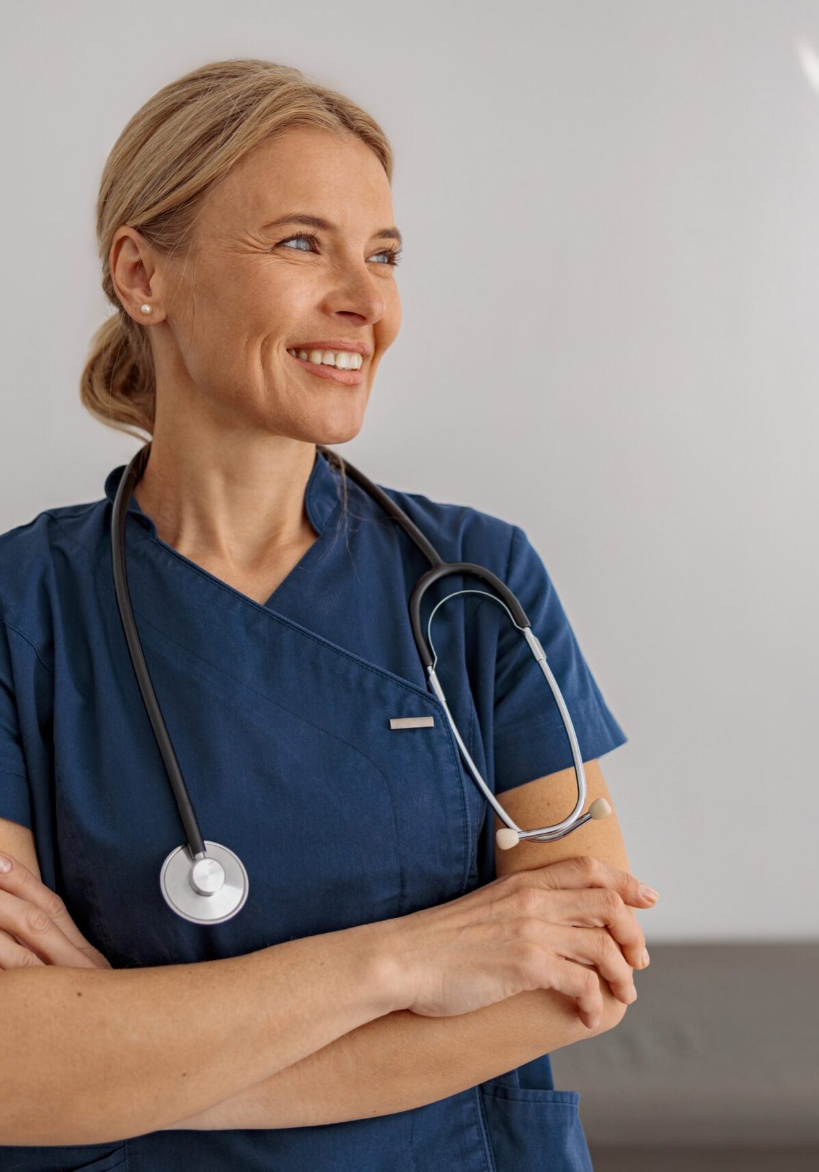 Smiling,Professional,Woman,Doctor,With,Stethoscope,On,Her,Workplace,In